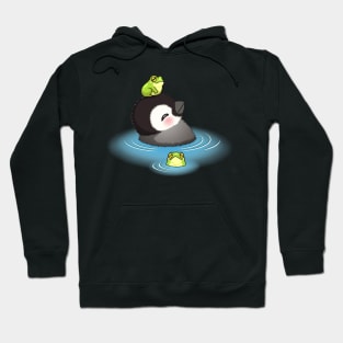 Happy emperor penguin chick with frog Hoodie